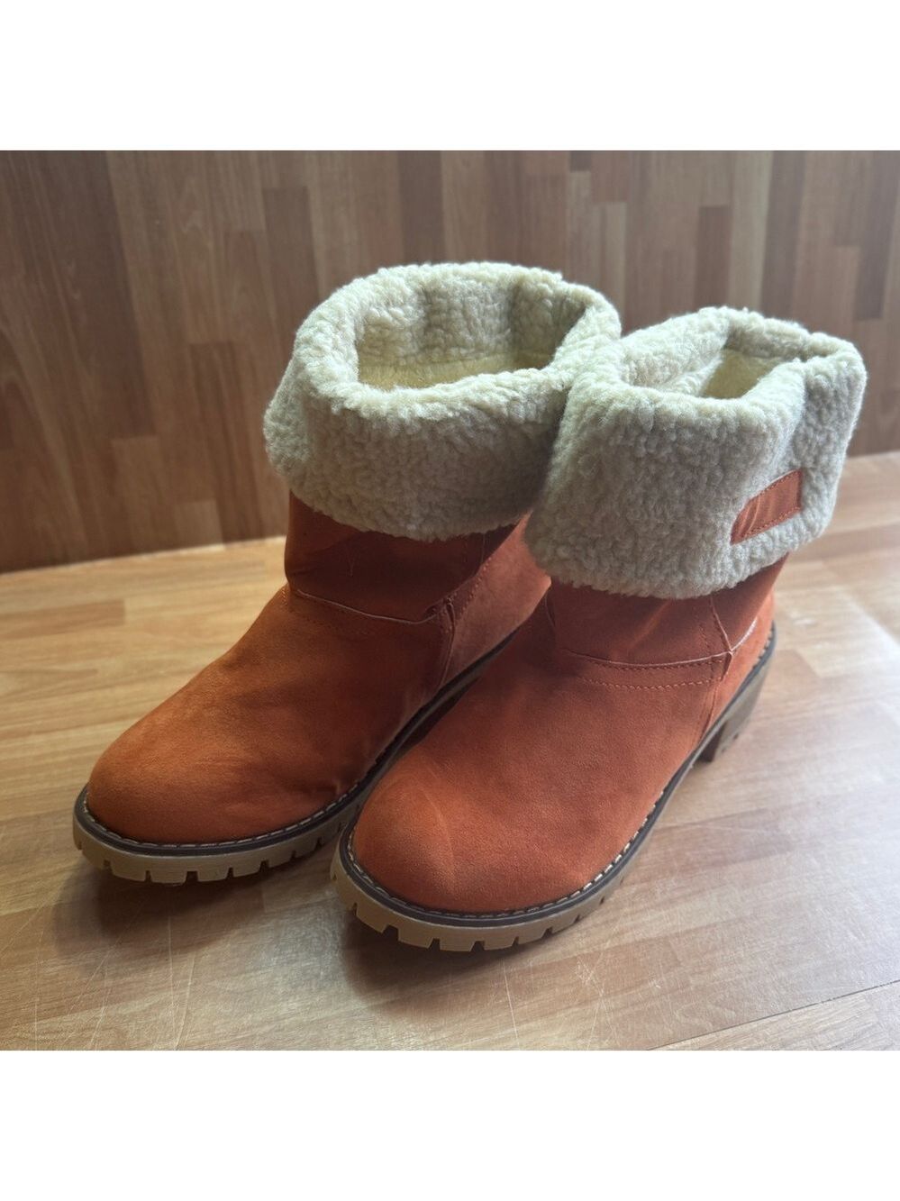 Orange suede like heeled booties with Sherpa like trim size 8.5